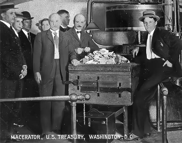 Destruction committee posing with $500,000 of condemned banknotes ready to be destroyed.