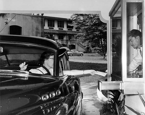 Image of a drive-through window at the National City Bank of New York in 1953.