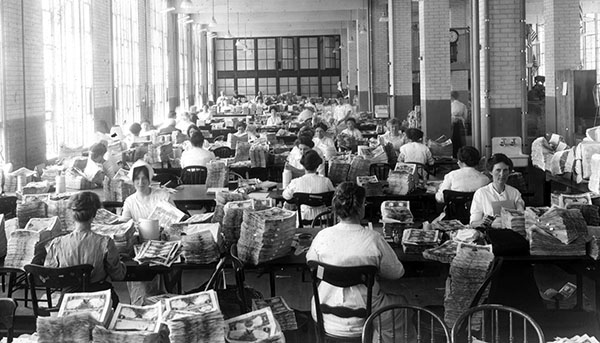 Quality control inspectors work through silver certificates before serial numbering.